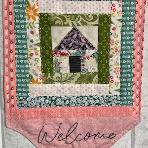 Quilted Welcome Banner, Log Cabin block with embroidery.