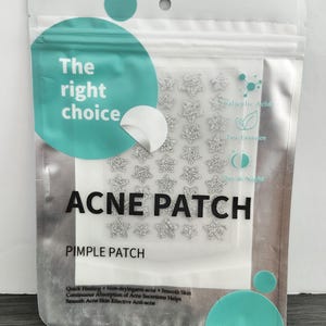 May include: Clear plastic pouch containing acne patches. The pouch has a teal and white design with the words "The right choice" and "ACNE PATCH" in bold letters. The patches are star-shaped and silver.