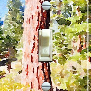 May include: A light switch cover with a watercolor painting of a forest scene. The switch is in the "ON" position.