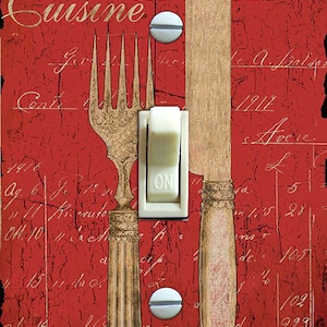 May include: A red and white light switch cover with a vintage design featuring a fork and knife. The text "Kitchen Cuisine love of food recipes" is printed on the cover.