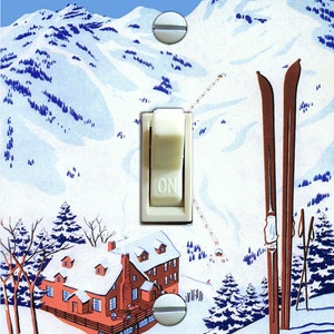 May include: A rectangular light switch plate featuring a vintage-style illustration of a snowy mountain landscape with a lodge, skis, and the text SKI ALTA. The design includes the text ALTA LODGE IN THE WASATCH MOUNTAINS JUST ABOVE SALT LAKE CITY.