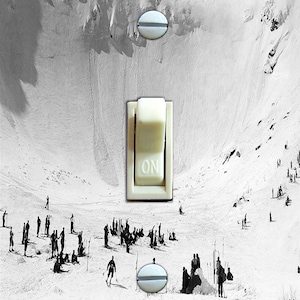 May include: A black and white photograph of a snowy mountain scene with skiers and a light switch with the word "ON" on it.