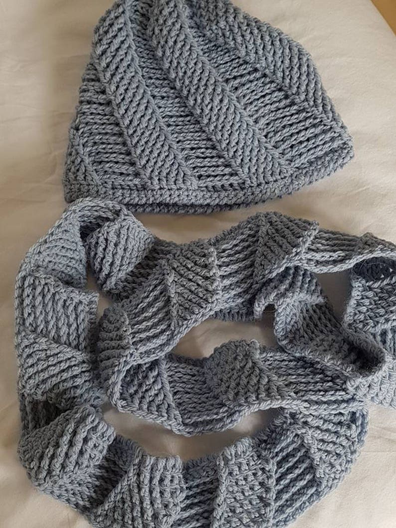 Blue cork-screw patterned matching beanie hat and looped scarf set hand crocheted
