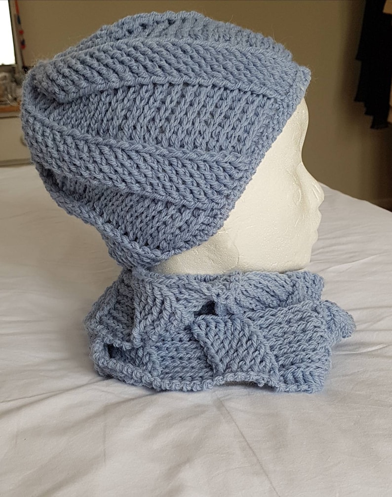 Blue cork-screw patterned matching beanie hat and looped scarf set hand crocheted