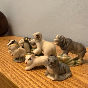 A Collection Of Eight Vintage Wade Whimsies Miniature Figurines - Variety Of Sets And Polar Set Six