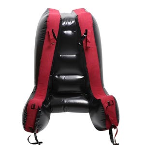 May include: Black inflatable backpack with red shoulder straps and buckles. The backpack is designed with a curved shape and features adjustable straps for a secure fit. The material appears to be a glossy, durable plastic.