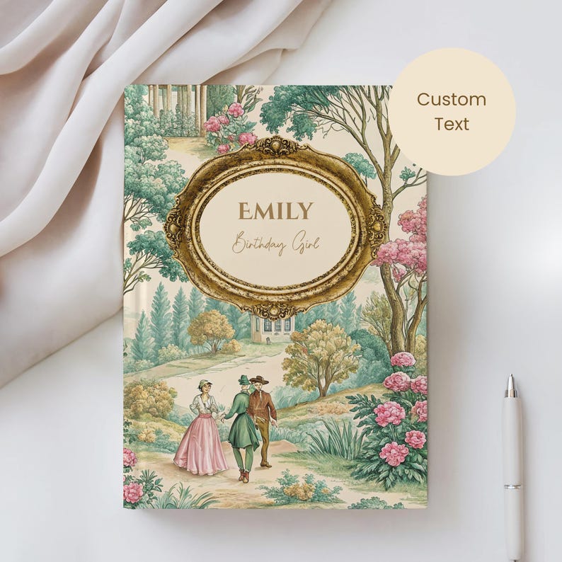 May include: A personalized journal with a vintage landscape design. The cover features a gold ornate frame with the name "Emily" and "Birthday Girl" in elegant script. The design includes a garden scene with figures and floral elements.
