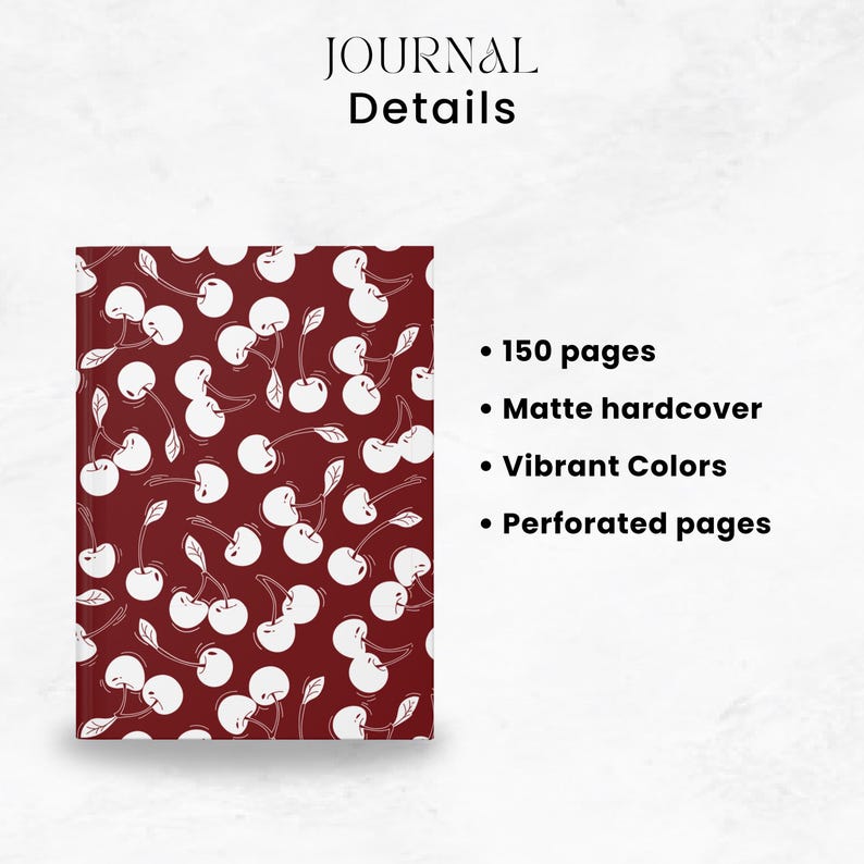May include: A journal with a burgundy cover featuring a white cherry pattern. The text "JOURNAL Details" is at the top. Additional text highlights features: 150 pages, matte hardcover, vibrant colors, and perforated pages.