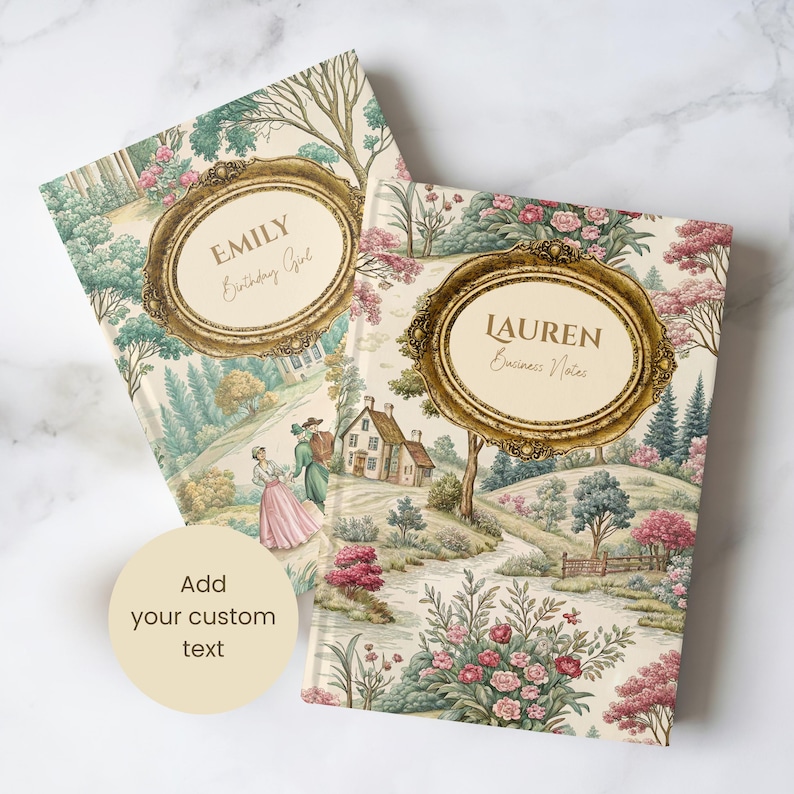 May include: Two hardcover journals with a vintage landscape design. One journal features the name "EMILY Birthday Girl" in a gold frame, the other reads "LAUREN Business Notes". The journals have a cream background with pink and green floral and tree details.