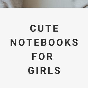 May include: A notebook with a cherry pattern on a white background. The notebook is held by a person. The image also includes the text "CUTE NOTEBOOKS FOR GIRLS".
