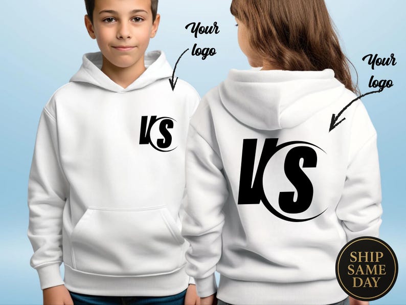 May include: White hooded sweatshirt with a black logo on the front and back. The logo features the letters "VS" in a bold, stylized font. The sweatshirt has a front pocket and a hood.