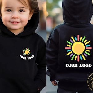 May include: Black hooded sweatshirt with a colorful sun graphic on the front and back. The front of the sweatshirt has the text "YOUR LOGO" below the sun graphic. The back of the sweatshirt also has the sun graphic and the text "YOUR LOGO".