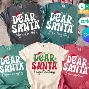 May include: Five short-sleeved crew neck t-shirts in charcoal, teal, cream, and red. Each shirt features the text 'Dear Santa' with a red hat icon and snowflakes, plus unique phrases: 'My sister did it', 'It's a long story', 'Define naughty', 'I regret nothing', and 'I can explain'.