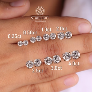 May include: A selection of diamond stud earrings in various carat sizes, from 0.25ct to 4.0ct, displayed on a hand. The earrings are set in gold and are labeled with their carat weight. The Starlight Diamond Love logo is visible.