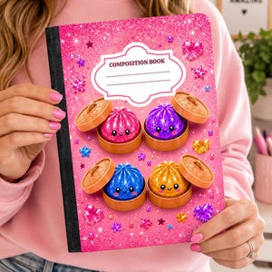May include: A composition book with a bright pink glitter background featuring four colorful, smiling dumpling characters in bamboo steamers. The cover includes a white label with the text COMPOSITION BOOK and scattered pink, blue, and yellow star and heart shapes.
