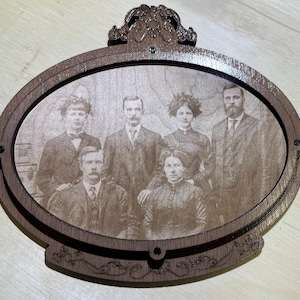 Antique style engraved wooden photoframe of Doc Holiday, The Earp brothers, and the wifes