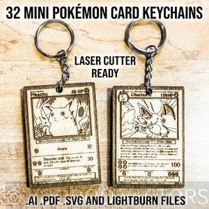 May include: Two wooden Pokémon card keychains featuring Pikachu and Charizard designs. Each keychain has a metal ring and chain. The text "32 MINI POKÉMON CARD KEYCHAINS" and "LASER CUTTER READY" are visible. The bottom of the image includes the text ".AI .PDF .SVG AND LIGHTBURN FILES".