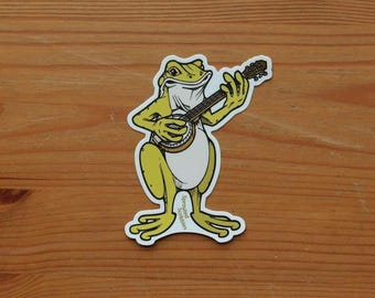 Pegatina de rana tocando el banjo