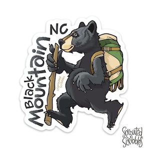 May include: A die-cut sticker featuring a black bear walking with a wooden hiking staff and a green and tan backpack. The text Black Mountain NC is printed in black lettering to the left of the bear. The Sprouted Scribbles logo is visible.