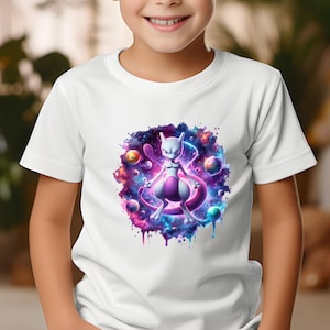 May include: A white t-shirt with a colourful graphic of a purple and white creature set against a nebula background. The design incorporates planets and watercolour effects, creating a dynamic image. The t-shirt is worn by a child.