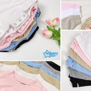 May include: A selection of baby clothes in shades of white, pink, blue, and black. The image shows folded onesies and crewneck sweatshirts. The Geminify Store logo is displayed in the image.