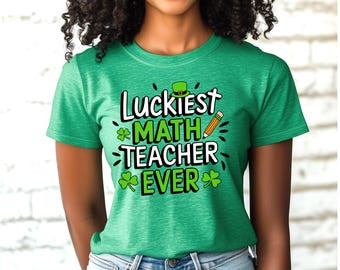 May include: Green t-shirt with the text "Luckiest MATH TEACHER EVER" in white and green. The design includes a green leprechaun hat, shamrocks, and a pencil. The shirt is made of a soft material.