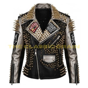 May include: Black leather jacket with silver detailing, embellished with gold spikes and studs. It has a zip closure, various patches, and a traditional biker jacket style. The jacket presents a striking, rebellious look.