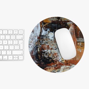May include: A white ceramic mug with a black handle and the text "But First, Coffee" in a black, handwritten-style font. The mug is on a white surface.
