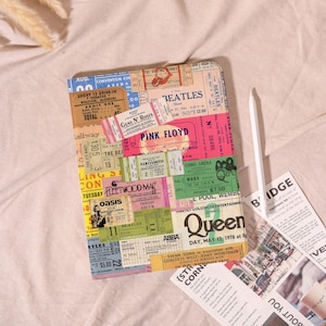 May include: A colourful tablet cover with a collage of vintage concert tickets. Bands such as The Beatles, Pink Floyd, and Queen are visible. The cover includes text and a white stylus.