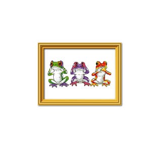 May include: A framed print featuring three colorful frogs in a "see no evil, hear no evil, speak no evil" pose. The frogs are green, purple, and orange, with detailed cross-stitch style textures. The frame is gold.