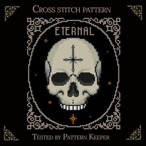 May include: A cross stitch pattern featuring a central skull with a cross symbol on the forehead, enclosed in an oval frame with decorative corners. The text reads CROSS STITCH PATTERN, ETERNAL, and TESTED BY PATTERN KEEPER in white lettering.