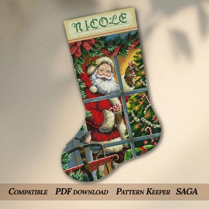 May include: A festive Christmas stocking with a cross-stitch design of Santa Claus at a window. The stocking is personalised with the name "Nicole" and features a Christmas tree and a bird. The text "COMPATIBLE PDF DOWNLOAD PATTERN KEEPER SAGA" is at the bottom.