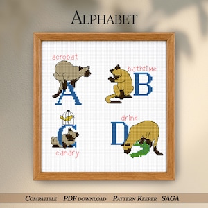 Puede incluir: Muestra de alfabeto bordada a punto de cruz en un marco de madera. La muestra presenta la palabra "Alphabet" en la parte superior. Cada letra va acompañada de un animal y una palabra: A para acróbata, B para hora del baño, C para canario y D para beber. El diseño está sobre un fondo blanco.