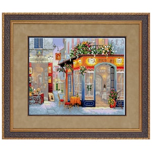 May include: Framed cross-stitch artwork depicting a European street scene with a restaurant, "L'Antico Sighio," and a bicycle. The artwork features a detailed, colorful design with flowers, tables, and chairs. The frame is a dark brown with a gold inner border.