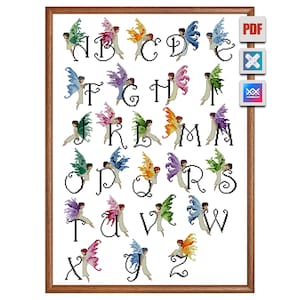 May include: Cross-stitch alphabet pattern featuring each letter with a fairy. The fairies have colorful wings in shades of green, pink, blue, orange, and purple. The letters are black on a white background, framed in a brown wooden frame.
