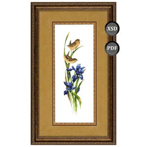 May include: Framed artwork featuring a watercolor-style painting of two small brown birds perched on green stems above blue iris flowers. The artwork is in a gold-colored frame with ornate detailing. The image also includes the text "XSD" and "PDF".