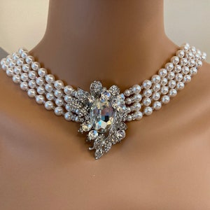 Audrey Necklace in Swarovski Pearls that drape down the back 4 multi strands with Brooch like Holly in the movie