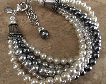 Grey Pearl Bracelet in a Twisted Pearl mix of Grey ivory Crystal Pearls with Rhinestone accents in a silver mother of the bride wedding