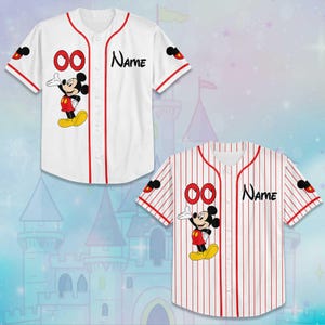 May include: Two baseball jerseys, one white and one red-striped, feature a cartoon mouse character. The white jersey has red accents and the text "Name". The red-striped jersey also has the text "Name". Both jerseys have the number "00".