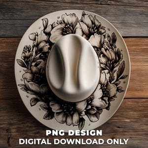 May include: A cream-colored cowboy hat rests on a decorative plate with a floral design. The plate features a black and white floral pattern. The image includes the text "PNG DESIGN DIGITAL DOWNLOAD ONLY".