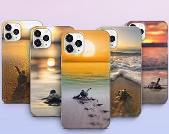 May include: A collection of phone cases featuring a sunset beach scene with baby sea turtles. The cases display a vibrant orange and yellow sky, golden sand, and gentle waves. Each case showcases a different perspective of the beach.