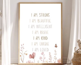 May include: A rectangular framed wall art print featuring the text I AM STRONG, I AM BEAUTIFUL, I AM INTELLIGENT, I AM BRAVE, I AM KIND, I AM UNIQUE, I AM LOVED in brown lettering, decorated with watercolor illustrations of pink flowers and a butterfly.
