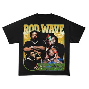 May include: Black t-shirt featuring a graphic of Rod Wave with the text "ROD WAVE" in a yellow, vintage-style font. The shirt also includes the text "REDEMPTION EXPERIENCE" in green.