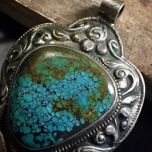 Tibetan pendant #1...Vintage Tibetan pendant, Tibetan Turquoise, Repousse pendant, tribal silver, ethnic jewelry