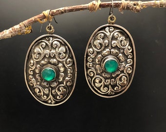 Artisan earrings..#2  tibetan silver / faceted teal glass / repousse design /