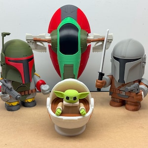 May include: A set of five Star Wars themed figurines, including Boba Fett, The Mandalorian, a green Baby Yoda in a pod, and a green and red spaceship.