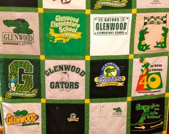 May include: A patchwork quilt made from t-shirts, each square showcasing "Glenwood Gators" and school-themed designs. The imagery includes alligators, stars, and the number 40. The quilt is bordered with green and yellow fabric.