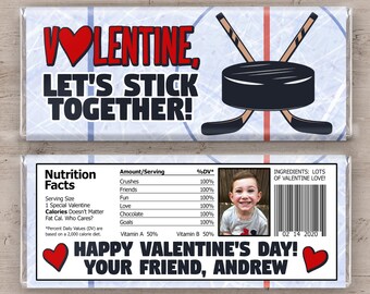 May include: A white chocolate bar wrapper with a hockey puck and sticks design. The text reads "Volentine, Let's Stick Together!" and "Happy Valentine's Day! Your Friend, Andrew".