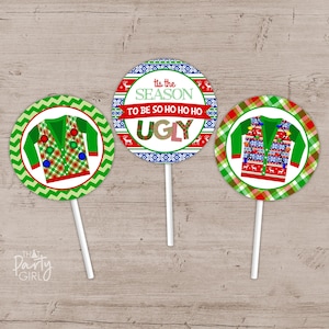 May include: Three round Christmas cupcake toppers with green and red patterned backgrounds. One topper features a red and green Christmas sweater with lights and a white background. Another topper features a red and green Christmas sweater with lights and a white background. The third topper features a red, white, and blue patterned background with the text "Tis the season to be so ho ho ho ugly".