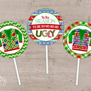 May include: Three round cupcake toppers with a green, red, and white Christmas sweater design. The top topper says "Tis the season to be so ho ho ho ugly".